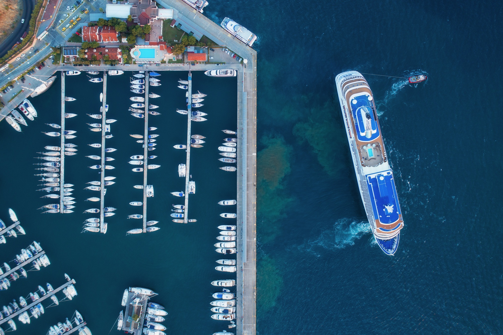 Aerial view of amazing boats at sunset. Minimalistic landscape