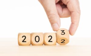 Hand changing Wooden Blocks with 2022 to 2023 year